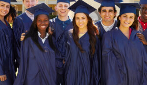 eight high school seniors in graduation attire.